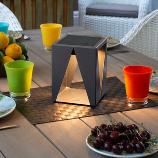 TeaTree table lantern illuminating outdoor dining table