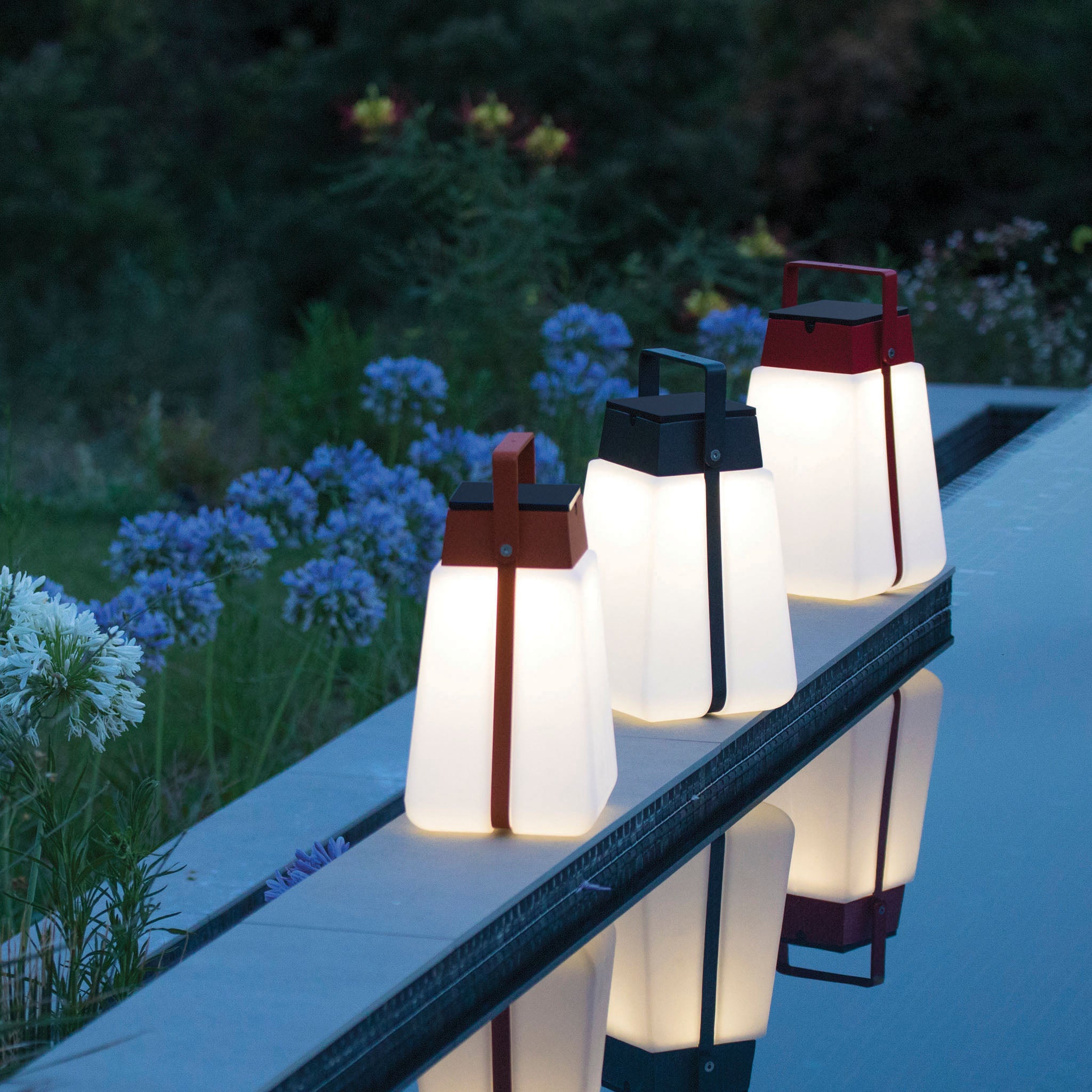3 bump solar lanterns lighting up outdoor pool and garden