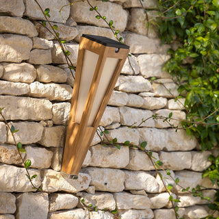 Lanai solar torch teak hanging on stone wall