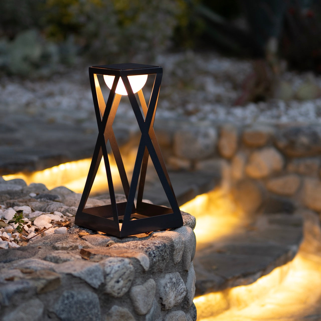 Rick solar lantern with ykary bulb outdoor on rock and steps