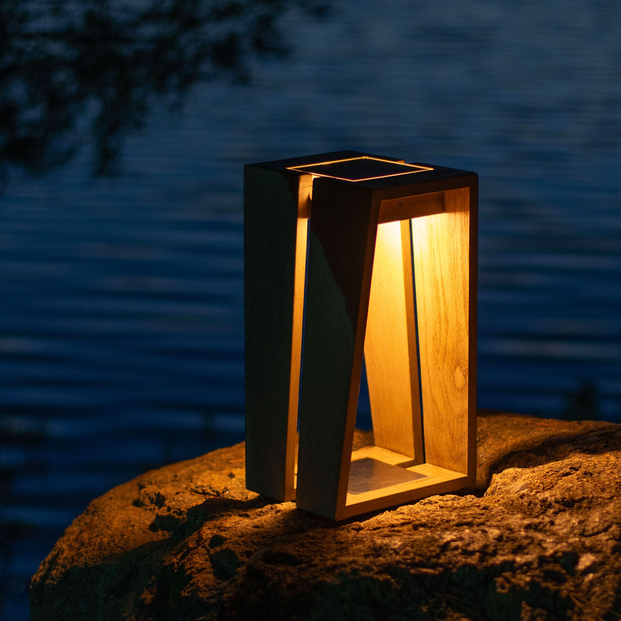 Skaal small weathered teak lantern on rock by the lake light up 