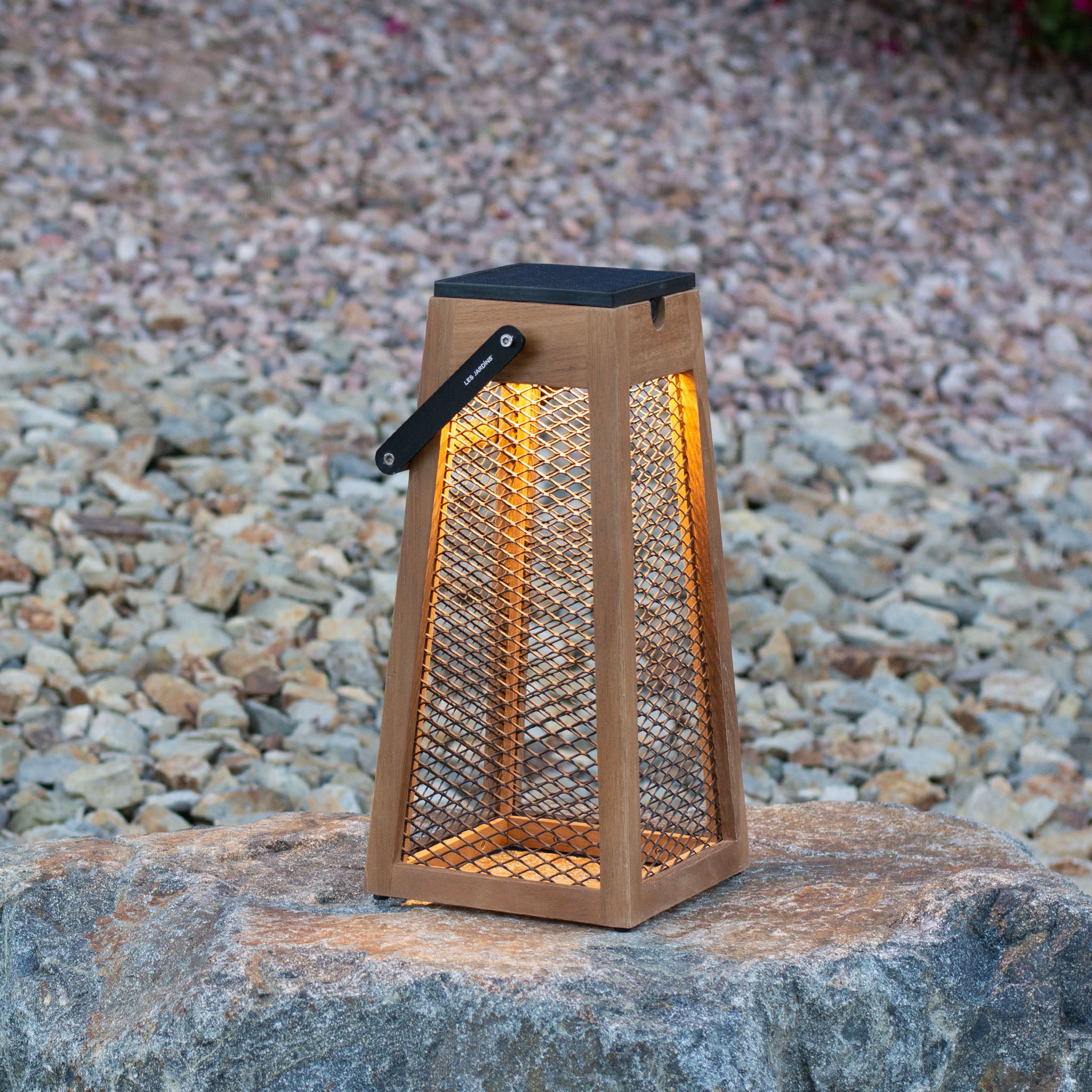 Roam solar lantern steel mesh on rocks background