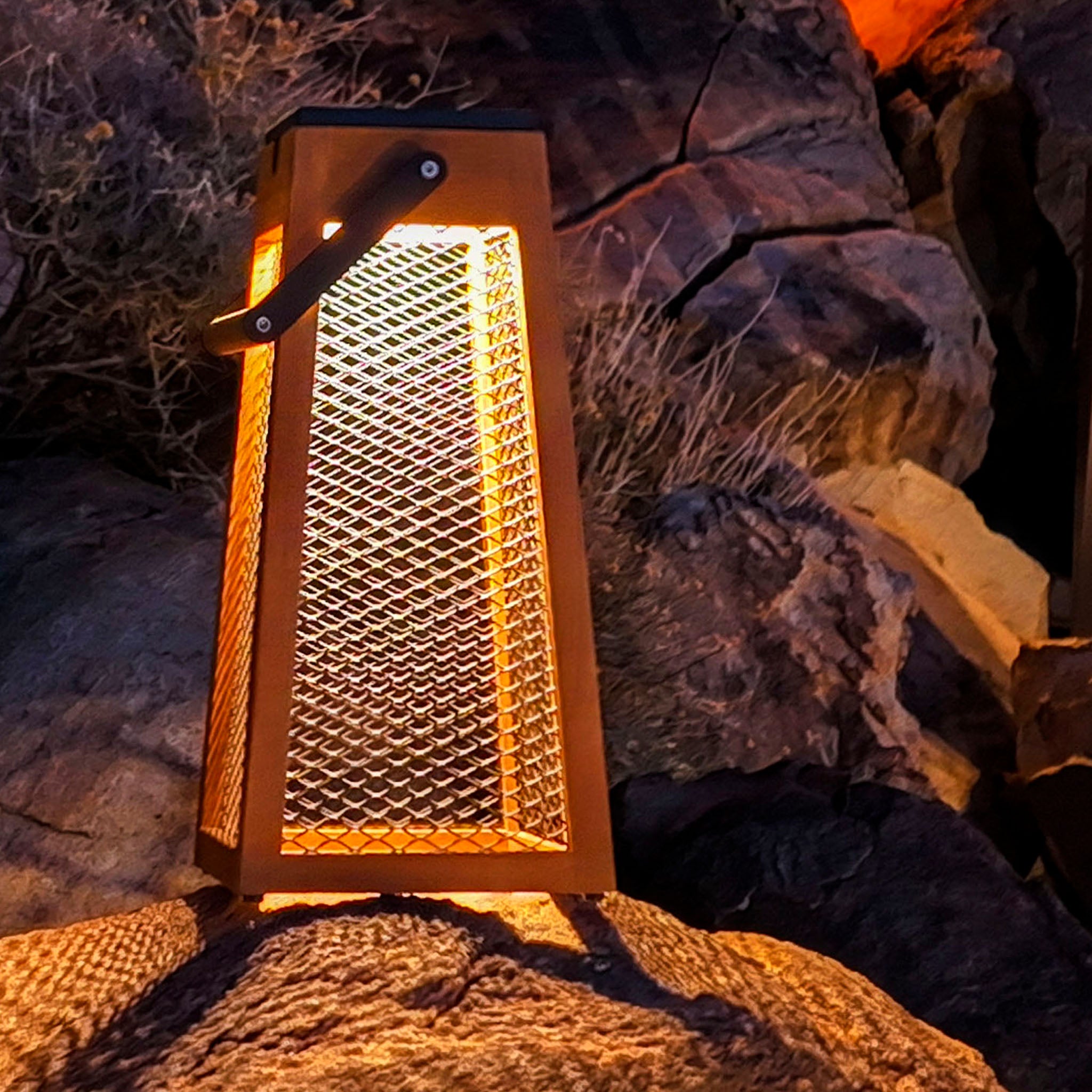 Roam solar lantern steel mesh light up rocky mountain at camping site